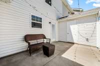 Alternate view of the patio with a private storage unit