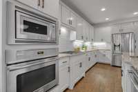 This expansive kitchen is a host’s dream, designed for both culinary creativity and effortless entertaining.