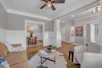 Here's a look from the den into the formal dining room. The floor plan of this home was thoughtfully-designed and has an abundance of light.