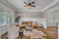 This house has so many great living spaces, including this den and adjacent formal dining room.