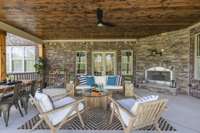 Large back porch with wood burning fireplace.