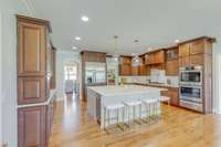 Double oven and gas built-in stove top.