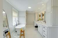 Separate tub and shower with double vanities.