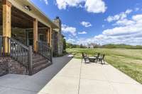 Large covered back porch and patio area.  Peaceful!