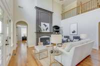 Gathering room with fireplace and 1 of 2 master suites on main level.