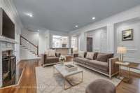 Family Room with Fireplace & built in bookshelves and cabinets.