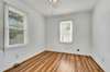 Living room features a ceiling fan and laminate flooring.