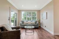 Sitting area in the primary bedroom has easy access to the covered back deck