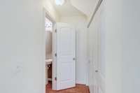 Hallway towards Powder Room and Laundry Closet.  Washer & Dryer Remain!