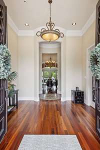 The Foyer is both Spacious and Inviting with the Tigerwood floors and High Ceilings.