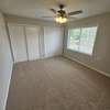 Main bedroom with double closets. new ceiling fan carpet, freshly painted.