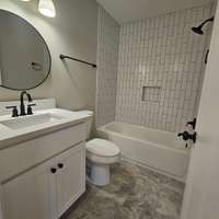 New floor tile, vanity and fixtures.