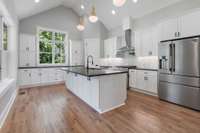 A glimpse into the beautiful outdoor green space from every angle in this kitchen.