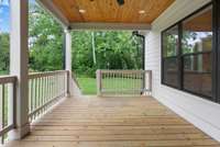 Deck off the living room entering the backyard.