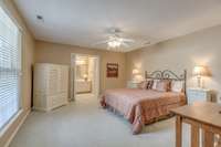 Very large master bedroom suite with windows onto patio