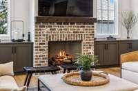 Storage cabinets on either side of the fireplace.