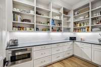 Amazing spacious walk in pantry.