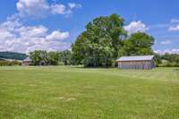 7.03 Acres of level valley land which has very little rock. It will make any building less expensive. Another perc site near the barn