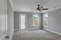 2nd floor bedroom with door to balcony and stunning views of the area.