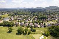 Nestled among the rolling hills of Tennessee, enjoy the lush green valley of this home.