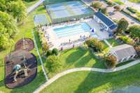 The HOA amenities area includes the adult pool, children's pool, grilling pavilion, tennis courts, basketball court, and playground, beside one of the fishing lakes with a walking trail.