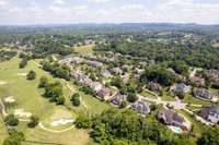 Located on a quiet cul-de-sac lot, 18 Tradition Lane has scenic views of common area, The Governors Club golf course, and a creek.