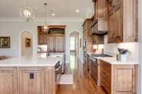 Owners have installed new lighting, custom quartz counters and light tile backsplash.