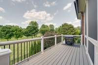 Serene golf course views capture your attention as you step through the new door onto the new deck, that allows you to access the backyard from the main level screened porch.