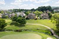 The home rests on the 18 hole Arnold Palmer Golf Course, with a burbling creek winding behind the home.