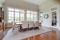 Simply stunning, this elegant room is awash in morning sunlight and provides access to the covered outdoor living area.