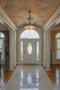 The grande foyer has a lit dome ceiling.