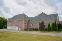 Spacious 4 car garage, along with a lot of parking space on the driveway