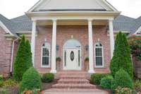 The beautiful brick greets you at every entry of this home.