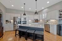 This kitchen is just stunning! Huge granite top island..