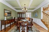 Formal Dining Room featuring extensive crown molding and woodwork