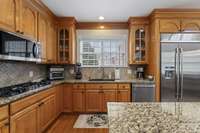 Gourmet Kitchen featuring Stainless Steel Double Oven, Gas Cooktop, Microwave, Dishwasher & Jenn-Air Sub-Zero Refrigerator