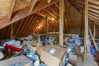 Large Attic area with easy access. It's actually the 3rd floor to this house. Endless possibilities what you could do with this much room - Storage, Office, Another Bedroom, etc