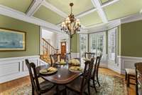 Formal Dining Room featuring extensive crown molding and woodwork