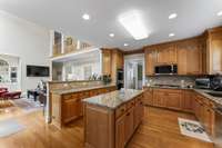 Gourmet Kitchen featuring Stainless Steel Double Oven, Gas Cooktop, Microwave, Dishwasher & Jenn-Air Sub-Zero Refrigerator