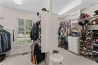 Primary Bedroom with an oversized His & Her Closet