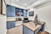 The owners added this office with custom cabinets & a built-in desk