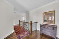 2nd floor landing with hardwood floors & crown moolding