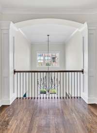 A view of the 2 story foyer from the 2nd floor