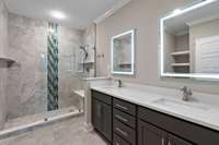 Double vanities and walk-in shower make this bathroom a sanctuary!