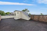 Rooftop patio that is nearly the entire footprint of the brownstone.