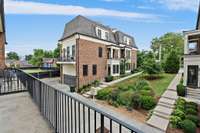 The 2nd floor balcony / porch provides space for either a small grill, pizza oven, seating or plants.  The unit overlooks the green space / common area.