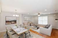 This Move-In Ready home has an OPEN FLOOR PLAN. Dining and Living Room pictured here. Partially virtually staged.