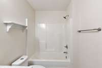 Renovated Hall Bathroom has new dual-flush toilet and tub/shower combination.