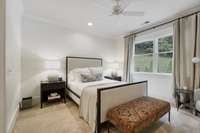 Bedroom 4 is an ensuite with private bath overlooking backyard.