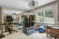 Fitness room features additional storage closet